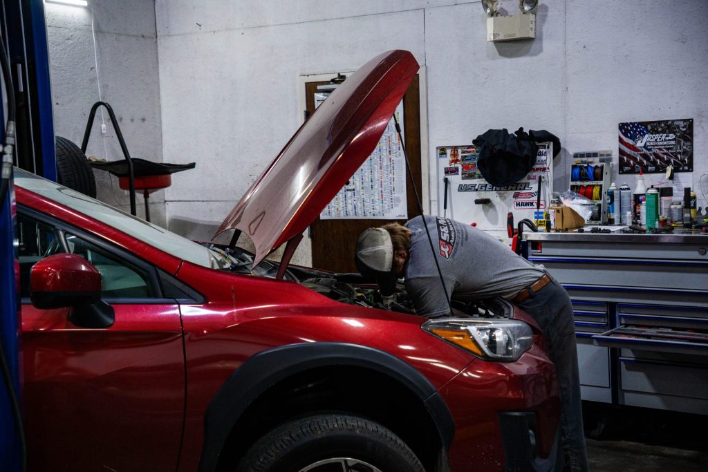 Mechanic Working On Engine